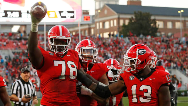 Georgia Bulldogs defensive lineman Nazir Stackhouse celebrates a turnover on defense in a college football game in the SEC.
