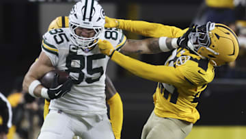 Oct 26, 2025; Pittsburgh, Pennsylvania, USA; Green Bay Packers tight end Tucker Kraft (85) stiff arms Pittsburgh Steelers safety Juan Thornhill (22) during the third quarter at Acrisure Stadium. Mandatory Credit: Charles LeClaire-Imagn Images