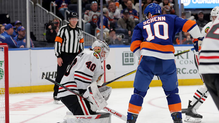 Mar 24, 2026; Elmont, New York, USA; Chicago Blackhawks goaltender Arvid Soderblom (40) makes a save against New York Islanders center Brayden Schenn (10) during the first period at UBS Arena. Mandatory Credit: Brad Penner-Imagn Images