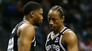 Mar 3, 2020; Charlotte, North Carolina, USA; San Antonio Spurs forward DeMar DeRozan (10) talks with forward Rudy Gay (22) during the second half against the Charlotte Hornets at Spectrum Center. Mandatory Credit: Jeremy Brevard-Imagn Images