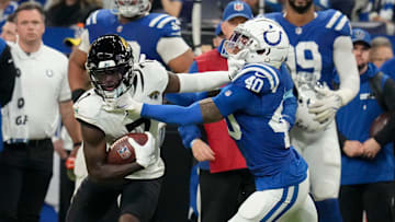Jacksonville Jaguars wide receiver Brian Thomas Jr. (7) pushes off of Indianapolis Colts cornerback Jaylon Jones (40) on Sunday, Jan. 5, 2025, during a game against the Jacksonville Jaguars at Lucas Oil Stadium in Indianapolis.