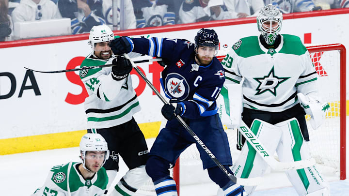 May 7, 2025; Winnipeg, Manitoba, CAN; Dallas Stars defenseman Cody Ceci (44) jostles for position with Winnipeg Jets forward Adam Lowry (17) in front of Dallas Stars goalie Jake Oettinger (29) during the third period in game one of the second round of the 2025 Stanley Cup Playoffs at Canada Life Centre. Mandatory Credit: Terrence Lee-Imagn Images