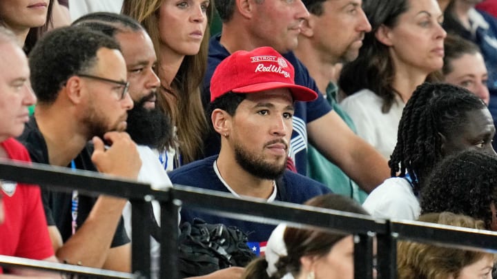 Aug 1, 2024; Paris, France; Devin Booker and Stephen Curry attend the womenís gymnastics all-around during the Paris 2024 Olympic Summer Games at Bercy Arena. Mandatory Credit: Kyle Terada-USA TODAY Sports