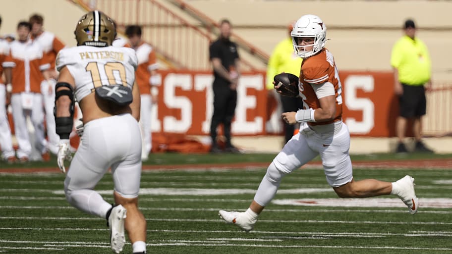 Arch Manning runs with the ball during Texas’s win vs. Vanderbilt.
