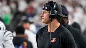 Injured Cincinnati Bengals quarterback Joe Burrow (9) walks the sideline with a headset in the second quarter of the NFL Week 7 game between the Cincinnati Bengals and the Pittsburgh Steelers at Paycor Stadium in downtown Cincinnati on Thursday, Oct. 16, 2025.