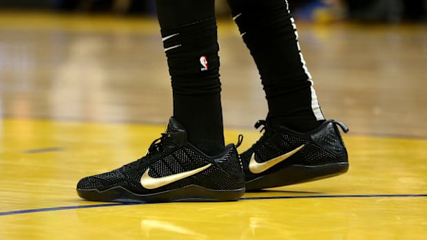 Anthony Davis's black and gold Nike sneakers.