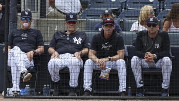 Mar 18, 2024; Tampa, Florida, USA;  New York Yankees manger Aaron Boone (17) (left) former manager