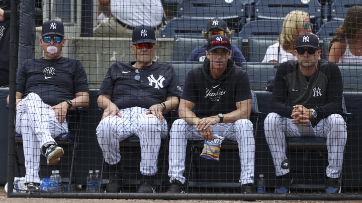 Mar 18, 2024; Tampa, Florida, USA;  New York Yankees manger Aaron Boone (17) (left) former manager
