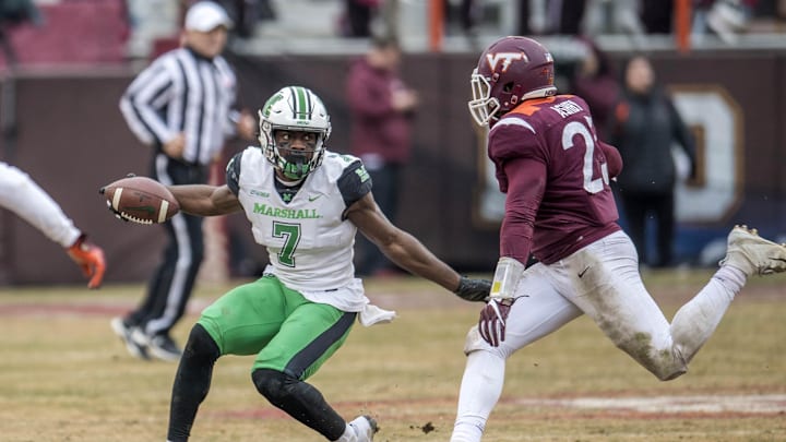 Dec 1, 2018; Blacksburg, VA, USA; Marshall Thundering Herd wide receiver Obi Obialo (7) runs in front of Virginia Tech Hokies defender Rayshard Asby (23) at Lane Stadium. Mandatory Credit: Lee Luther Jr.-Imagn Images