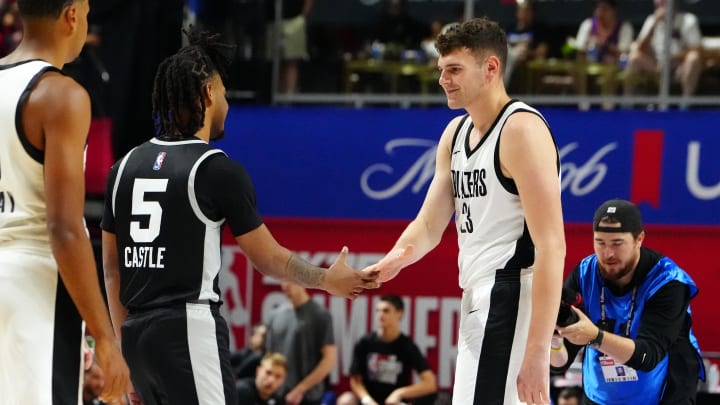 Jul 13, 2024; Las Vegas, NV, USA; Portland Trail Blazers center Donovan Clingan (23) greets San Antonio Spurs guard Stephon Castle (5) before the start of an NBA Summer League game at Thomas & Mack Center. Mandatory Credit: Stephen R. Sylvanie-USA TODAY Sports