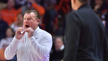 Dec 14, 2024; Champaign, Illinois, USA;  Illinois Fighting Illini head coach Brad Underwood reacts during the first half against the Tennessee Volunteers at State Farm Center. Mandatory Credit: Ron Johnson-Imagn Images