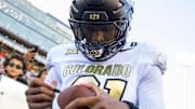Shilo Sanders signs an autograph during the 2024 Colorado Buffaloes season.