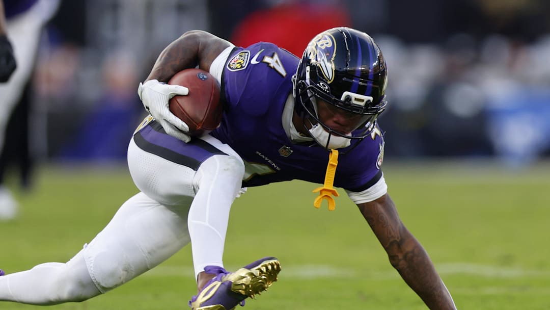 Dec 7, 2025; Baltimore, Maryland, USA; Baltimore Ravens wide receiver Zay Flowers (4) makes a catch against the Pittsburgh Steelers during the second half at M&T Bank Stadium. Mandatory Credit: Peter Casey-Imagn Images