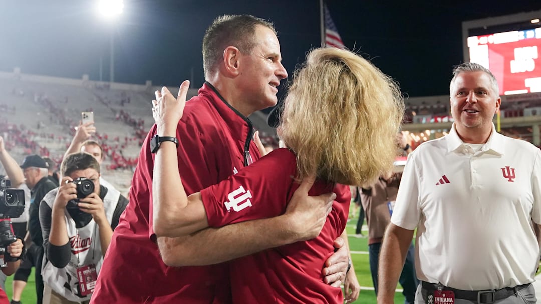 Sep 20, 2025; Bloomington, Indiana, USA; Indiana Hoosiers head coach Curt Cignetti celebrates with Indiana University President Pamela Whitten after defeating the Illinois Fighting Illini at Memorial Stadium. Mandatory Credit: Robert Goddin-Imagn Images