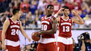 Apr 6, 2015; Indianapolis, IN, USA; Wisconsin Badgers players Bronson Koenig (24), Nigel Hayes (10) and Duje Dukan (13) react after a foul call against the Duke Blue Devils in the second half in the 2015 NCAA Men's Division I Championship game at Lucas Oil Stadium. Mandatory Credit: Bob Donnan-Imagn Images