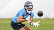May 10, 2025; Nashville, TN, USA;  Tennessee Titans wider receiver Elic Ayomanor (5) makes a catch as he goes through drills during Rookie Mini Camp at Saint Thomas Sports Park. Mandatory Credit: Steve Roberts-Imagn Images
