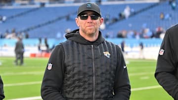 Nov 30, 2025; Nashville, Tennessee, USA;  Jacksonville Jaguars head coach Liam Coen smiles to the crowd as he walks of the field against the Tennessee Titans during the second half at Nissan Stadium. Mandatory Credit: Steve Roberts-Imagn Images