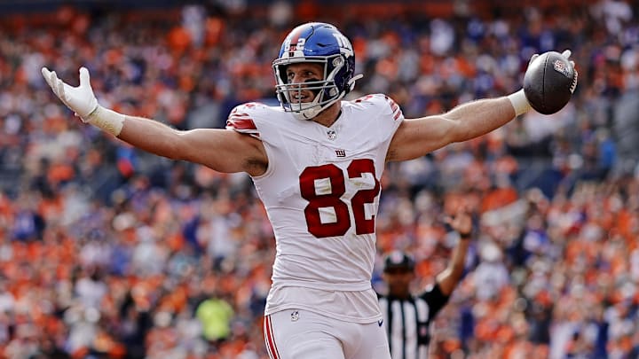 Oct 19, 2025; Denver, Colorado, USA; New York Giants tight end Daniel Bellinger (82) celebrates after scoring a touchdown during the first half against the Denver Broncos at Empower Field at Mile High. Mandatory Credit: Isaiah J. Downing-Imagn Images