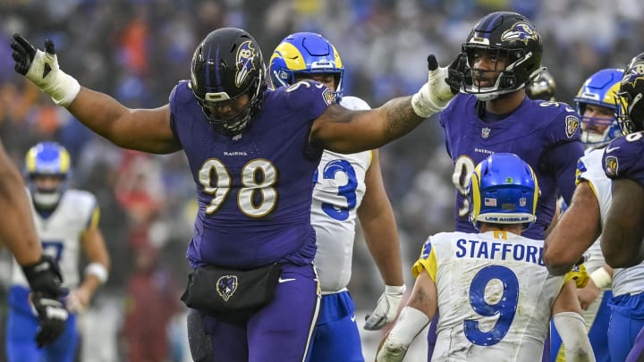 Dec 10, 2023; Baltimore, Maryland, USA; Baltimore Ravens defensive tackle Travis Jones (98) reacts after sacking Los Angeles Rams quarterback Matthew Stafford (9)  during the second  half at M&T Bank Stadium. Mandatory Credit: Tommy Gilligan-USA TODAY Sports