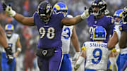 Dec 10, 2023; Baltimore, Maryland, USA; Baltimore Ravens defensive tackle Travis Jones (98) reacts after sacking Los Angeles Rams quarterback Matthew Stafford (9)  during the second  half at M&T Bank Stadium. Mandatory Credit: Tommy Gilligan-Imagn Images