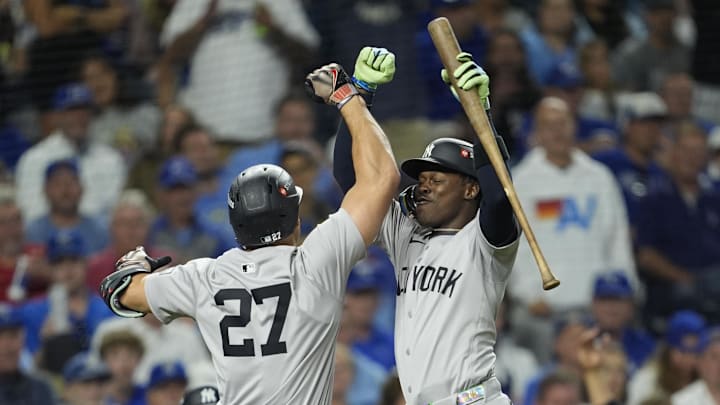 New York Yankees designated hitter Giancarlo Stanton (27) celebrates with New York Yankees third base Jazz Chisholm Jr.