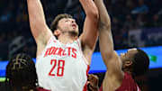Mar 26, 2023; Cleveland, Ohio, USA; Houston Rockets center Alperen Sengun (28) shoots over the defense of Cleveland Cavaliers forward Evan Mobley (4) during the first half at Rocket Mortgage FieldHouse. Mandatory Credit: Ken Blaze-Imagn Images