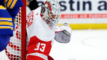 Dec 9, 2024; Buffalo, New York, USA;  Detroit Red Wings goaltender Sebastian Cossa (33) looks for the puck during the second period against the Buffalo Sabres at KeyBank Center. Mandatory Credit: Timothy T. Ludwig-Imagn Images