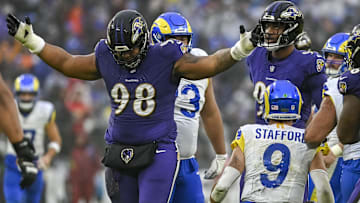 Dec 10, 2023; Baltimore, Maryland, USA; Baltimore Ravens defensive tackle Travis Jones (98) reacts after sacking Los Angeles Rams quarterback Matthew Stafford (9)  during the second  half at M&T Bank Stadium. Mandatory Credit: Tommy Gilligan-Imagn Images