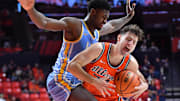 Nov 22, 2025; Champaign, Illinois, USA; Long Island University Sharks forward Mason Porter-Brown (6) pressures Illinois Fighting Illini guard Mihailo Petrovic (77) as he drives to the basket during the first half at State Farm Center. Mandatory Credit: Ron Johnson-Imagn Images