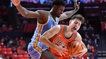 Nov 22, 2025; Champaign, Illinois, USA; Long Island University Sharks forward Mason Porter-Brown (6) pressures Illinois Fighting Illini guard Mihailo Petrovic (77) as he drives to the basket during the first half at State Farm Center. Mandatory Credit: Ron Johnson-Imagn Images