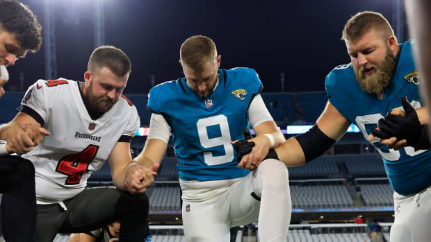 Jacksonville Jaguars punter Logan Cooke (9) pray with center Tyler Shatley (69) after a preseason NFL football game Saturday,