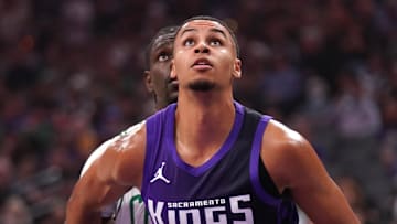 Mar 24, 2025; Sacramento, California, USA; Sacramento Kings forward Keegan Murray (13) battles for position with Boston Celtics guard Jrue Holiday (4) in the first quarter at the Golden 1 Center.