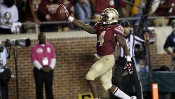 Oct 10, 2015; Tallahassee, FL, USA; FSU running back Dalvin Cook (4) celebrates his third touchdown of the game as Florida State beats Miami 29-24 at Doak Campbell Stadium. Mandatory Credit: Glenn Beil-Imagn Images