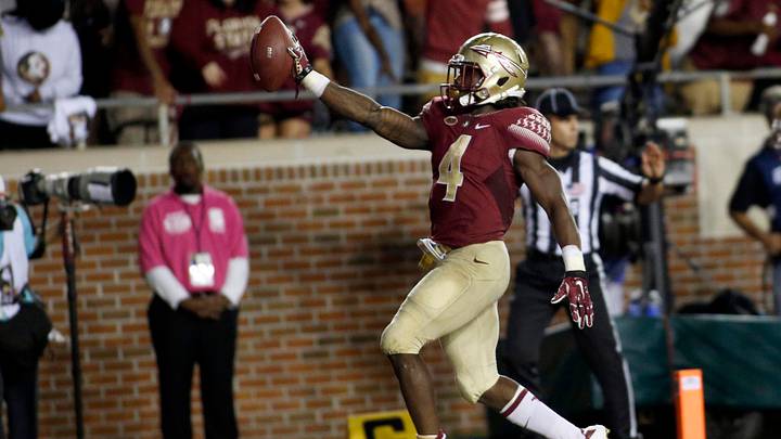 Oct 10, 2015; Tallahassee, FL, USA; FSU running back Dalvin Cook (4) celebrates his third touchdown of the game as Florida State beats Miami 29-24 at Doak Campbell Stadium. Mandatory Credit: Glenn Beil-USA TODAY Sports