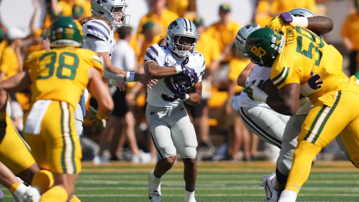 Oct 4, 2025; Waco, Texas, USA; Kansas State Wildcats quarterback Avery Johnson (2) hands the ball to running back Dylan Edwards (3) against the Baylor Bears during the first half at McLane Stadium. 