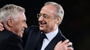 Florentino Perez (R), president of Real Madrid CF, hugs...