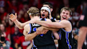 Feb 22, 2025; Tucson, Arizona, USA; BYU Cougars center Keba Keita (13), guard Trey Stewart (1) and guard Dallin Hall (30) celebrate a win against the Arizona Wildcats at the end of the game at McKale Center. Mandatory Credit: Aryanna Frank-Imagn Images