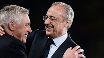 Florentino Perez (R), president of Real Madrid CF, hugs...