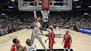 Dec 17, 2023; San Antonio, Texas, USA; San Antonio Spurs forward Victor Wembanyama (1) dunks over New Orleans Pelicans Brandon Ingram (14) during the first half at Frost Bank Center.