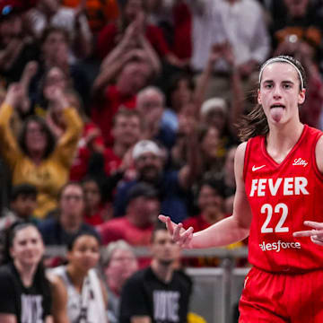 Indiana Fever guard Caitlin Clark (22) reacts to scoring a 3-pointer Friday, Sept. 13, 2024, during a game between the Indiana Fever and the Las Vegas Aces on Friday, Sept. 13, 2024, at Gainbridge Fieldhouse in Indianapolis. The Aces defeated the Fever, 78-74.