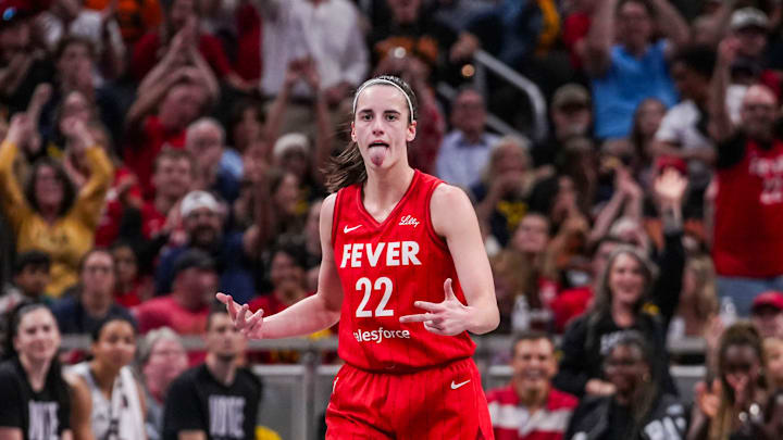 Indiana Fever guard Caitlin Clark (22) reacts to scoring a 3-pointer Friday, Sept. 13, 2024, during a game between the Indiana Fever and the Las Vegas Aces on Friday, Sept. 13, 2024, at Gainbridge Fieldhouse in Indianapolis. The Aces defeated the Fever, 78-74.