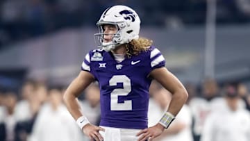 Dec 26, 2024; Phoenix, AZ, USA; Kansas State Wildcats quarterback Avery Johnson (2) against the Rutgers Scarlet Knights during the Rate Bowl at Chase Field. Mandatory Credit: Mark J. Rebilas-Imagn Images