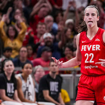 Indiana Fever guard Caitlin Clark (22) reacts to scoring a 3-pointer Friday, Sept. 13, 2024, during a game between the Indiana Fever and the Las Vegas Aces on Friday, Sept. 13, 2024, at Gainbridge Fieldhouse in Indianapolis. The Aces defeated the Fever, 78-74.