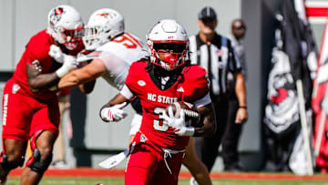 Oct 4, 2025; Raleigh, North Carolina, USA;  NC State Wolfpack running back Hollywood Smothers (3) runs with the ball during the first half of the game against Campbell Fighting Camels at Carter-Finley Stadium. Mandatory Credit: Jaylynn Nash-Imagn Images