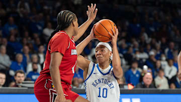 Kentucky Wildcats guard Dazia Lawrence (10) looks for an open pass around Louisville Cardinals forward Mackenly Randolph (4) during their game on Saturday, Nov. 16, 2024 at Memorial Coliseum in Lexington, Ky.