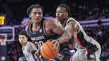 Jan 28, 2025; Athens, Georgia, USA; South Carolina Gamecocks forward Collin Murray-Boyles (30) dribbles against Georgia Bulldogs forward RJ Godfrey (10) at Stegeman Coliseum. Mandatory Credit: Dale Zanine-Imagn Images