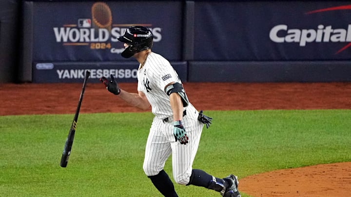 New York Yankees designated hitter Giancarlo Stanton (27) hits a solo home during the third inning against the Los Angeles Dodgers in game four of the 2024 MLB World Series at Yankee Stadium. New York Yankees designated hitter Giancarlo Stanton (27) hits a solo home during the third inning against the Los Angeles Dodgers in game four of the 2024 MLB World Series at Yankee Stadium.