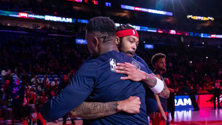 Feb 14, 2024; New Orleans, Louisiana, USA;  New Orleans Pelicans forward Brandon Ingram (14) hugs forward Zion Williamson (1) as he is announced to the fans to start the game against the Washington Wizards during the first half at Smoothie King Center. 