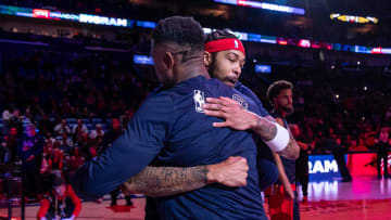 Feb 14, 2024; New Orleans, Louisiana, USA;  New Orleans Pelicans forward Brandon Ingram (14) hugs forward Zion Williamson (1) as he is announced to the fans to start the game against the Washington Wizards during the first half at Smoothie King Center.