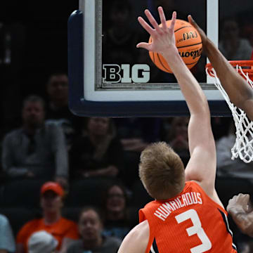 Mar 14, 2025; Indianapolis, IN, USA; Maryland Terrapins forward Tafara Gapare (6) blocks Illinois Fighting Illini forward Ben Humrichous (3) during the first half at Gainbridge Fieldhouse. Mandatory Credit: Robert Goddin-Imagn Images